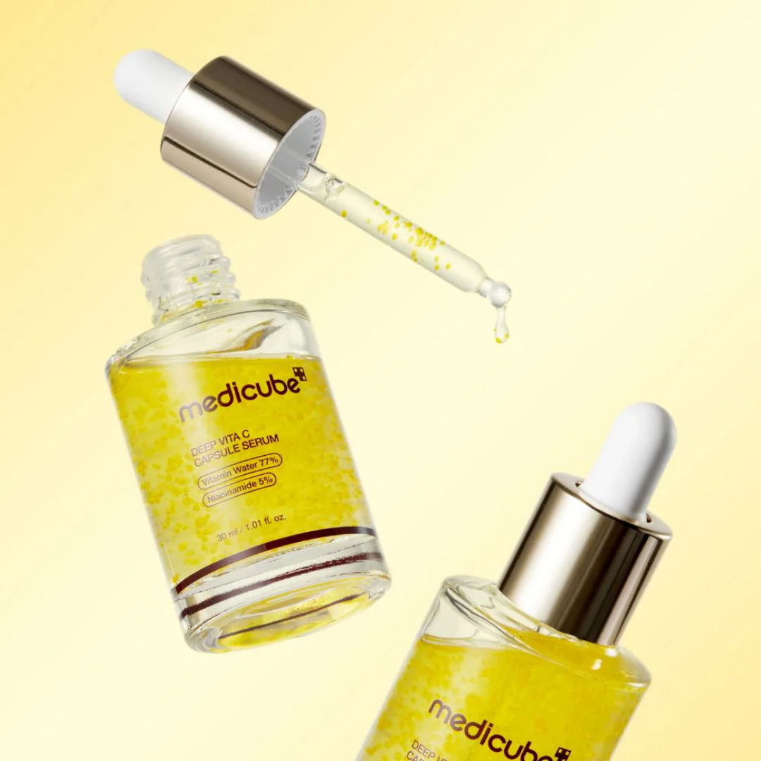 Medicube Deep Vita C Capsule Serum floating bottle and dropper